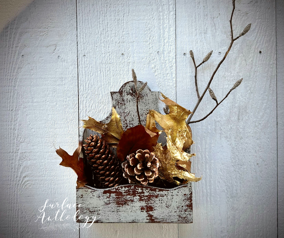 gilded pine cones and leaves